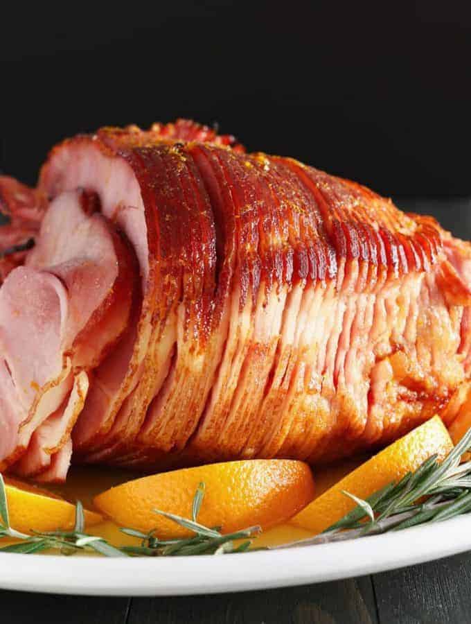 This easy orange honey ham is perfect for Easter or Christmas dinner. You only need 4 ingredients to get this easy holiday meal on the table.