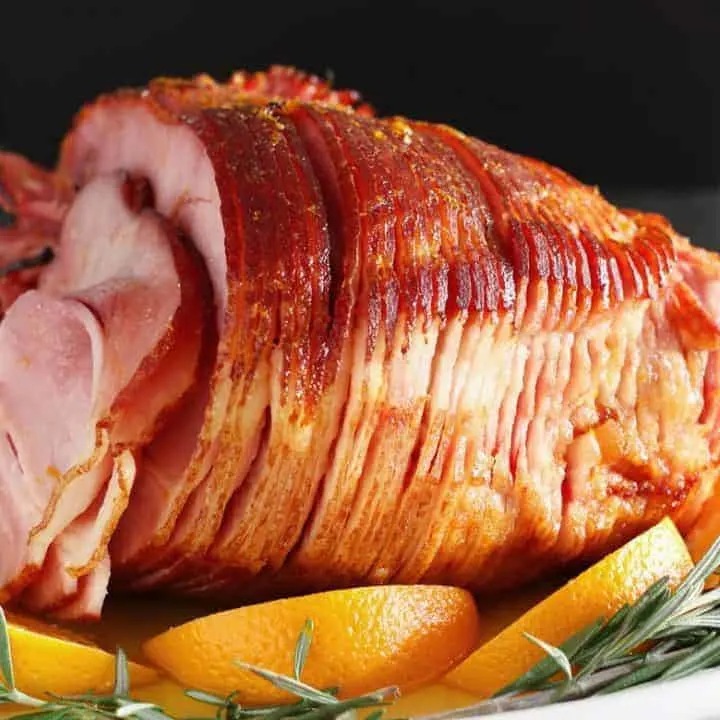 This easy orange honey ham is perfect for Easter or Christmas dinner. You only need 4 ingredients to get this easy holiday meal on the table.