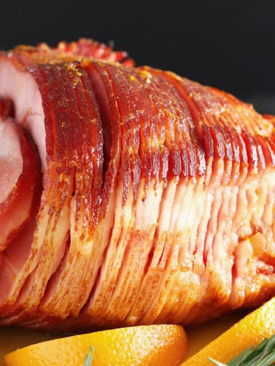 This easy orange honey ham is perfect for Easter or Christmas dinner. You only need 4 ingredients to get this easy holiday meal on the table.