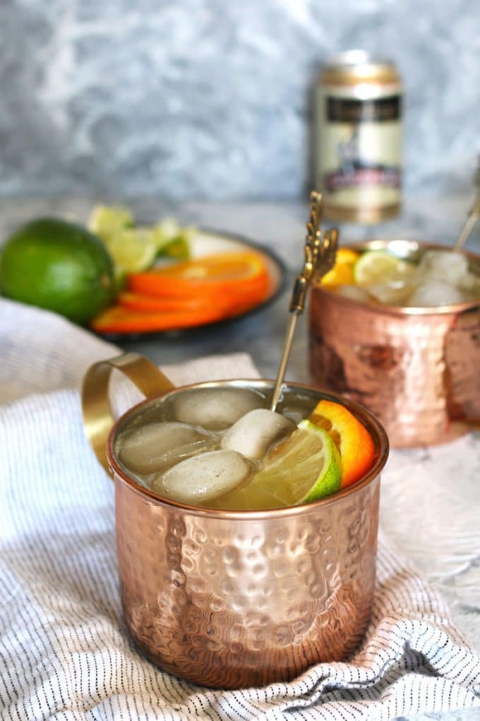 two orange Moscow mule cocktails