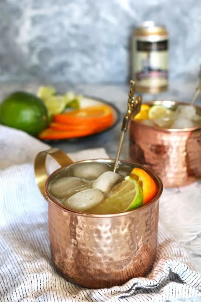 two orange Moscow mule cocktails
