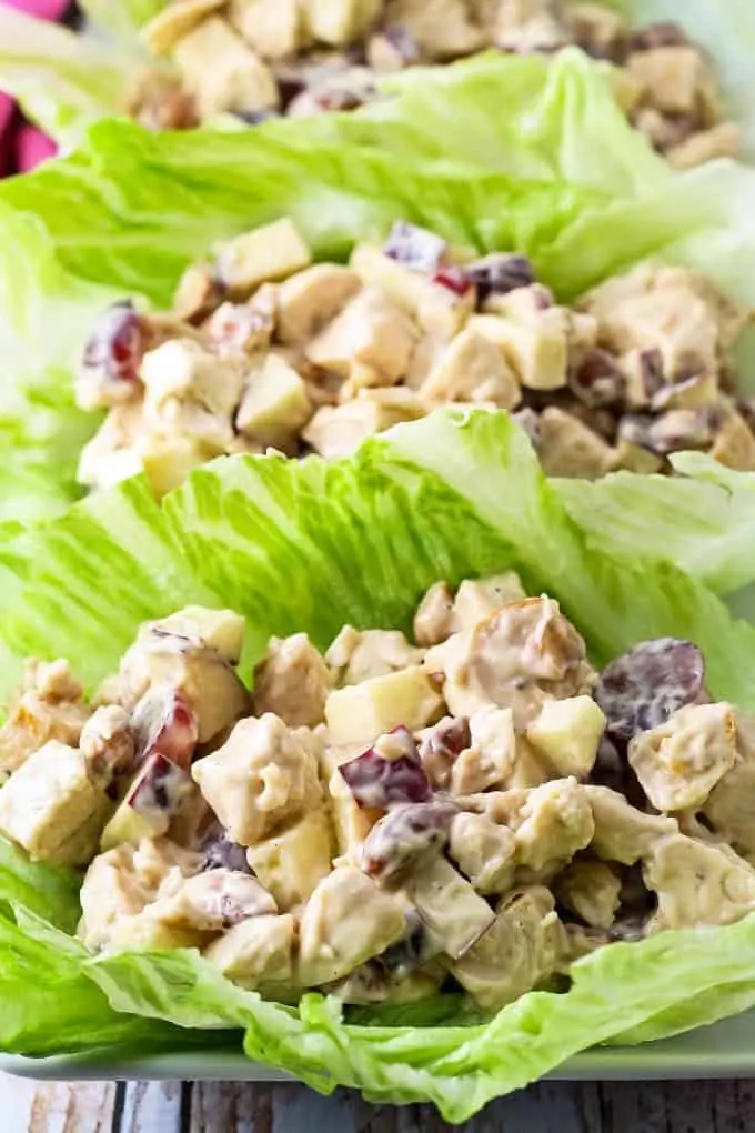 two chicken salad lettuce wraps on a plate