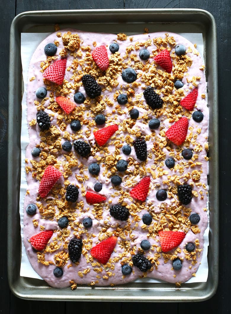 This triple berry granola frozen yogurt breakfast bark is perfect for busy mornings. It's like eating a make-ahead breakfast parfait popsicle and is great for feeding a crowd! Uncracked bark from above.
