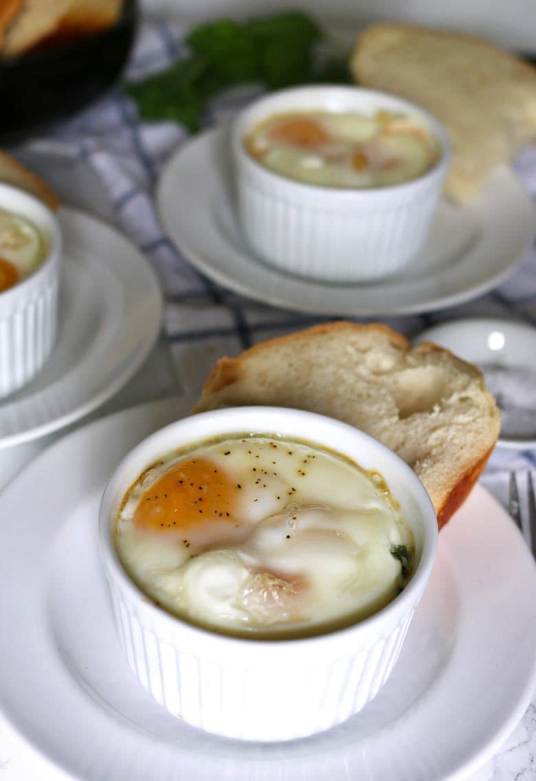 Caprese baked eggs only require 4 ingredients and a little salt and pepper. This easy recipe is going to become your go-to quick recipe for breakfast or brunch!