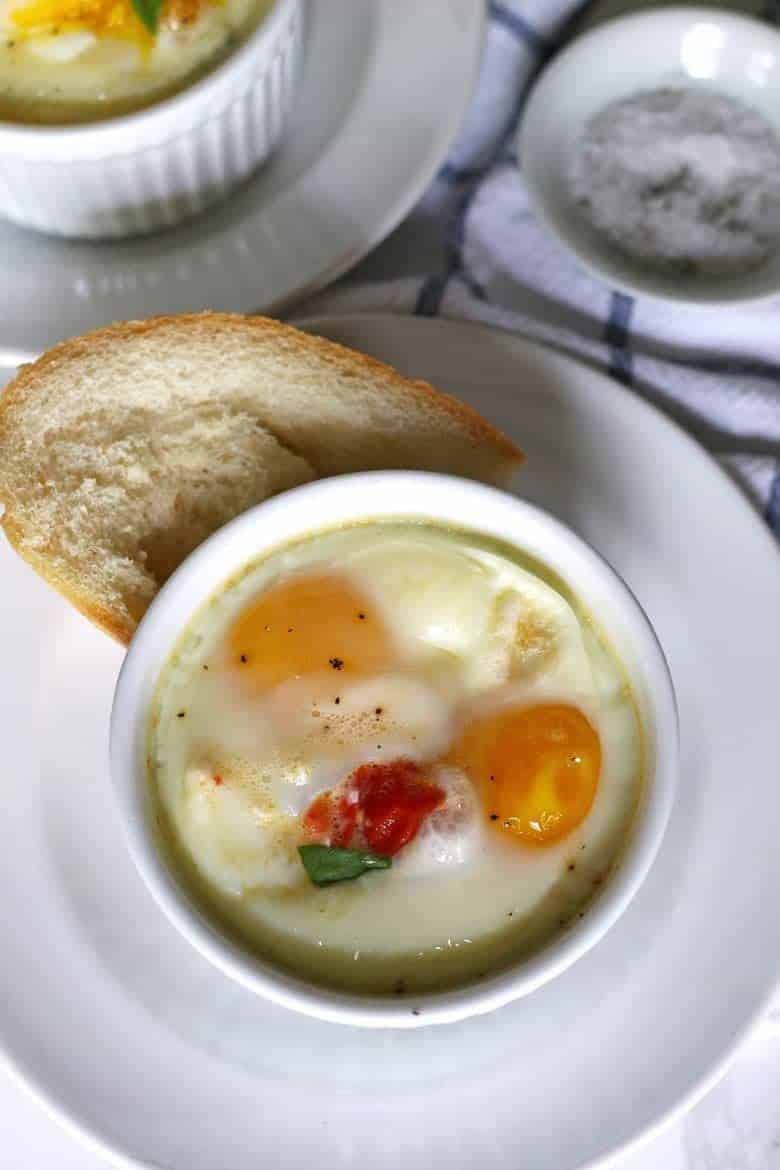 Caprese baked eggs only require 4 ingredients and a little salt and pepper. This easy recipe is going to become your go-to quick recipe for breakfast or brunch!