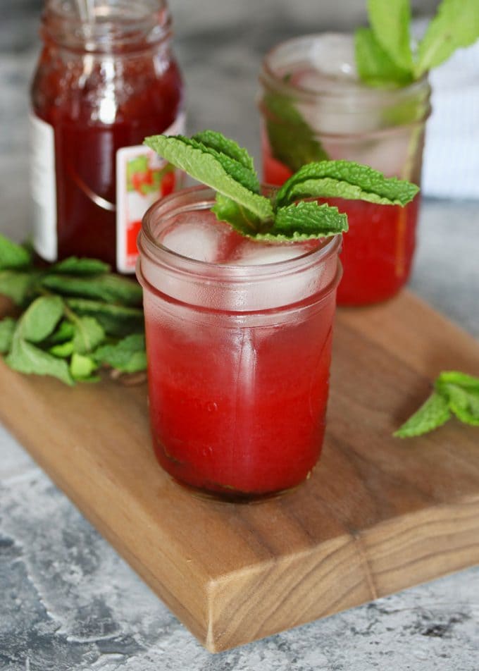 2 mint strawberry jam cocktails and a jar of jam