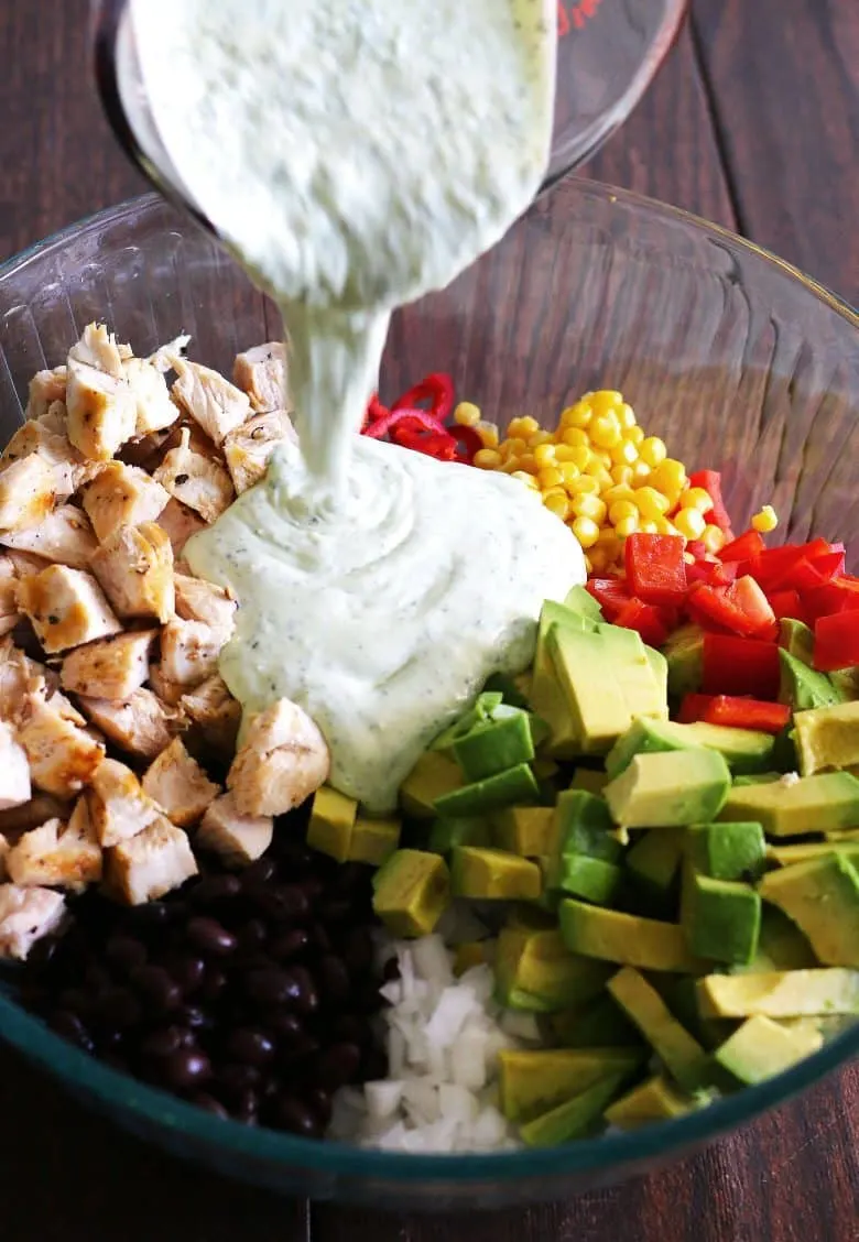 grilled chicken avocado salad topped with homemade jalapeno cilantro dressing