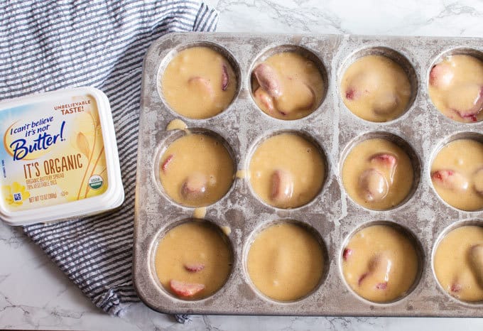 Enjoy the taste of spring year-round with this recipe for Gluten-Free Strawberry Muffins using frozen strawberries!