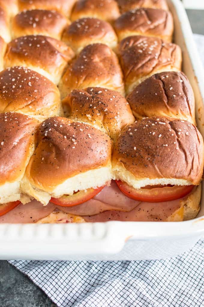 Pimento cheese tomato ham sliders are the perfect party food! Perfect for big crowds, these flavorful sandwiches will be the star of your next event.