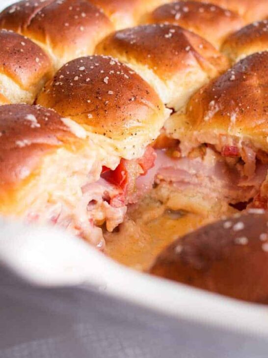 Pimento cheese tomato ham sliders are the perfect party food! Perfect for big crowds, these flavorful sandwiches will be the star of your next event.