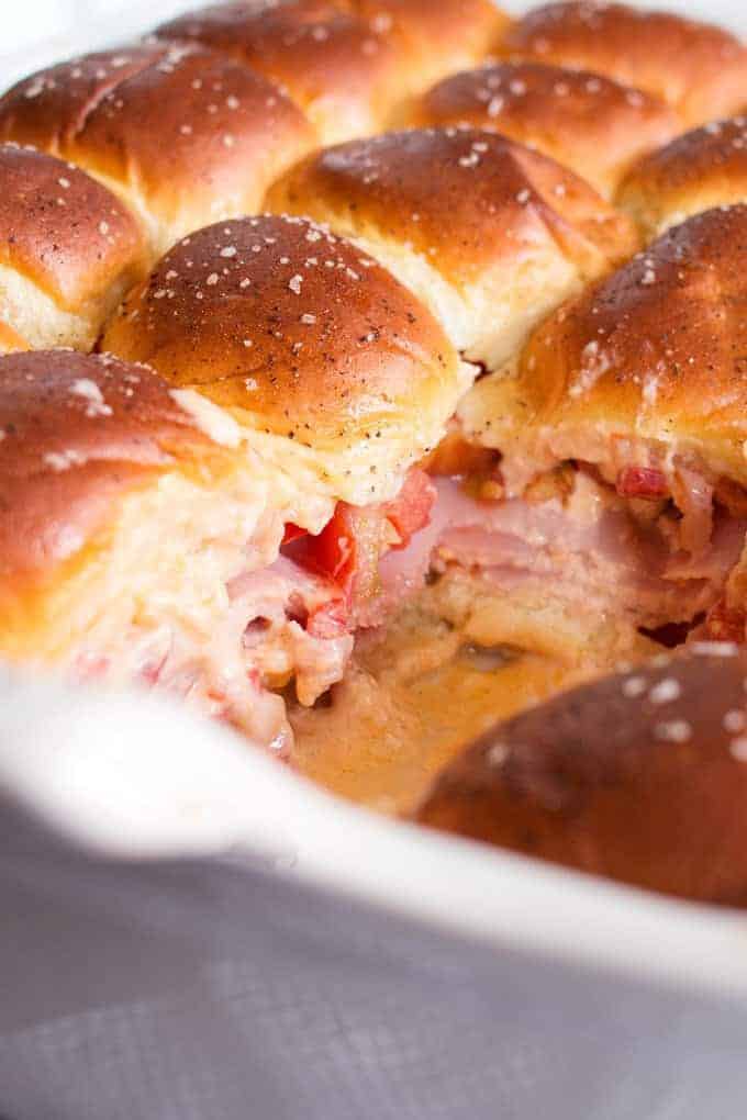 Pimento cheese tomato ham sliders are the perfect party food! Perfect for big crowds, these flavorful sandwiches will be the star of your next event.