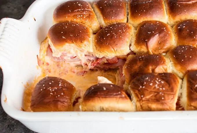 Pimento cheese tomato ham sliders are the perfect party food! Perfect for big crowds, these flavorful sandwiches will be the star of your next event.