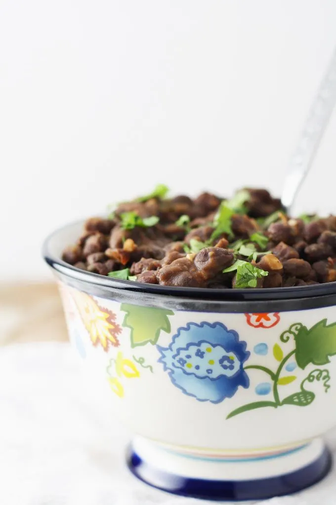 seasoned black beans on a wooden table