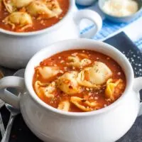 two bowls of tomato tortellini soup