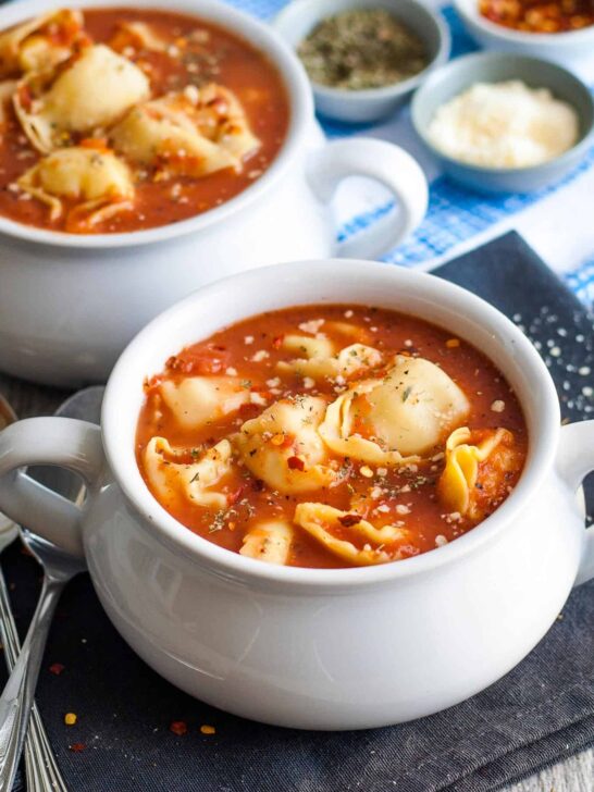 two bowls of tomato tortellini soup