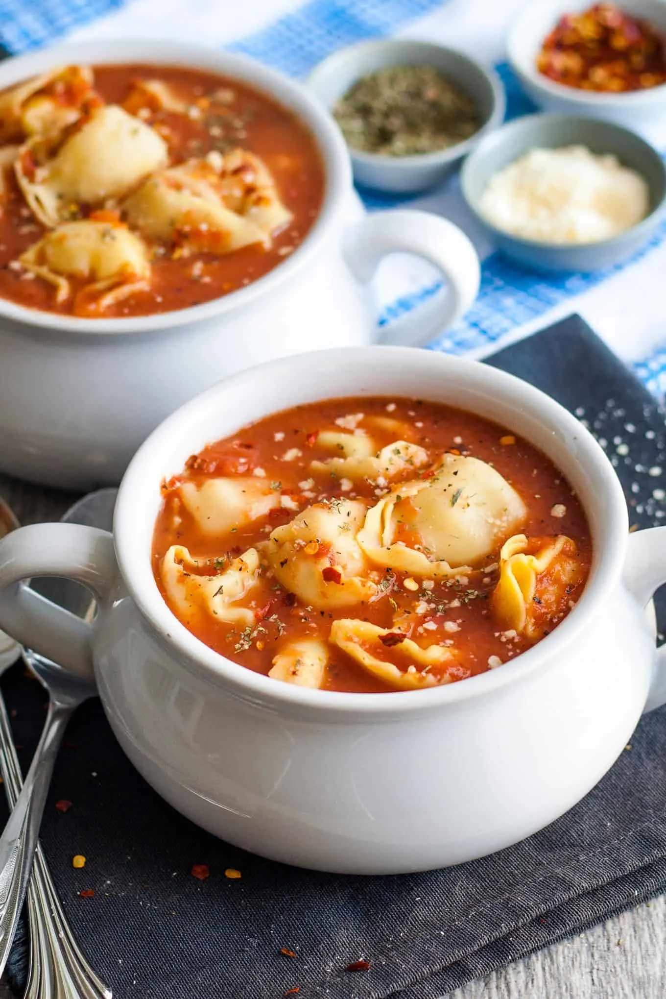 two bowls of tomato tortellini soup