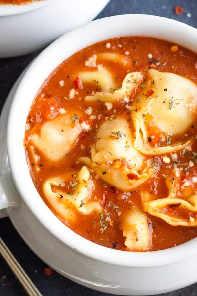 overhead photo of tomato soup with tortellini