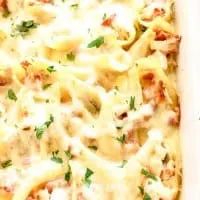 chicken bacon Alfredo stuffed shells in a white casserole dish