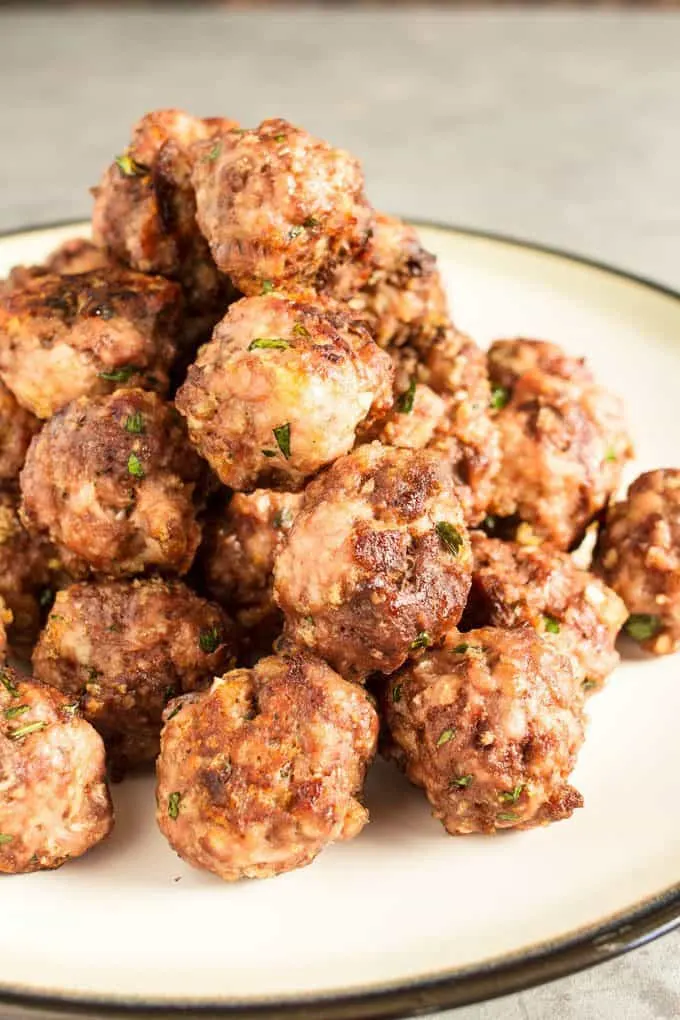 This easy homemade spaghetti and meatballs recipe is perfect for busy weeknights. Prep the meatballs the day before and then pop them in the oven when it's time for dinner!