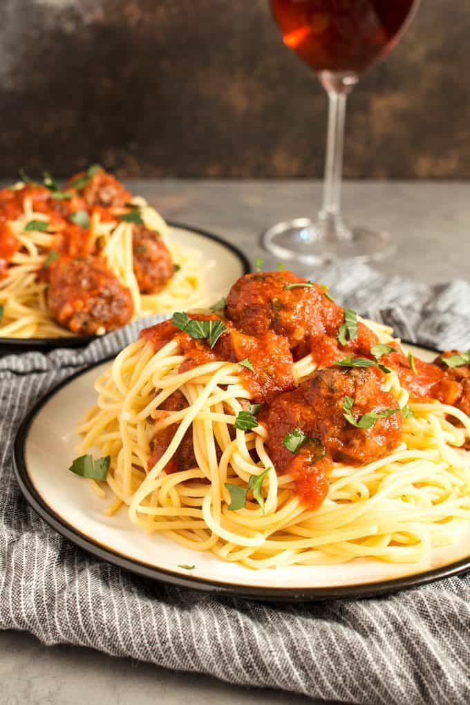 This easy homemade spaghetti and meatballs recipe is perfect for busy weeknights. Prep the meatballs the day before and then pop them in the oven when it's time for dinner!