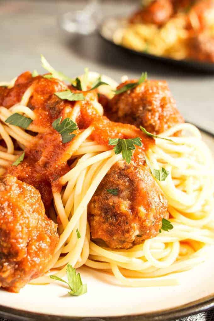 This easy homemade spaghetti and meatballs recipe is perfect for busy weeknights. Prep the meatballs the day before and then pop them in the oven when it's time for dinner!