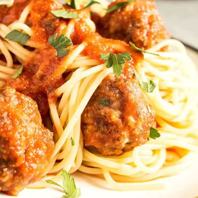 This easy homemade spaghetti and meatballs recipe is perfect for busy weeknights. Prep the meatballs the day before and then pop them in the oven when it's time for dinner!