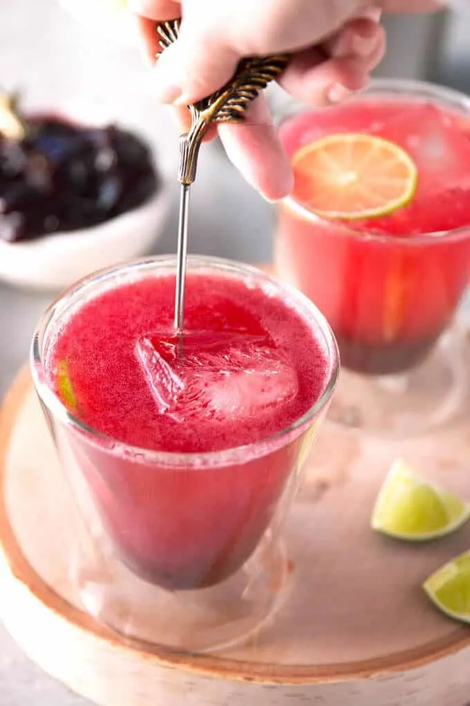 blackberry Moscow mule cocktail being stirred