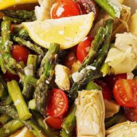 close up photo of asparagus and cherry tomato salad