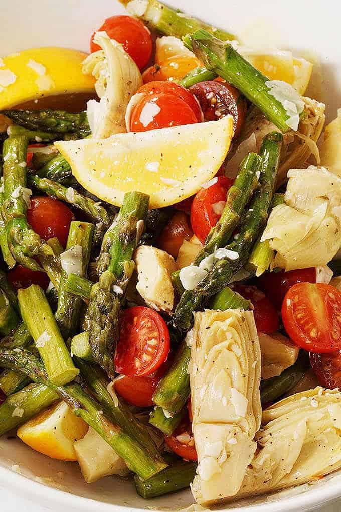 close up photo of asparagus and cherry tomato salad