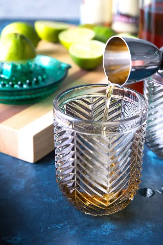 bourbon being poured into a glass