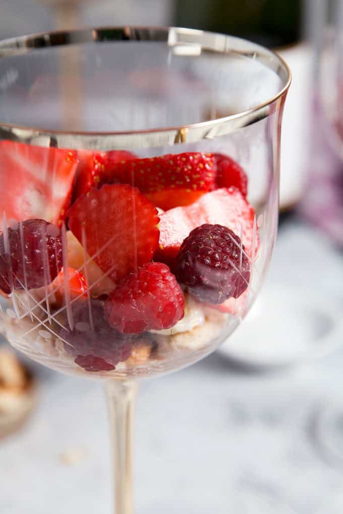 strawberries and raspberries in a wine glass