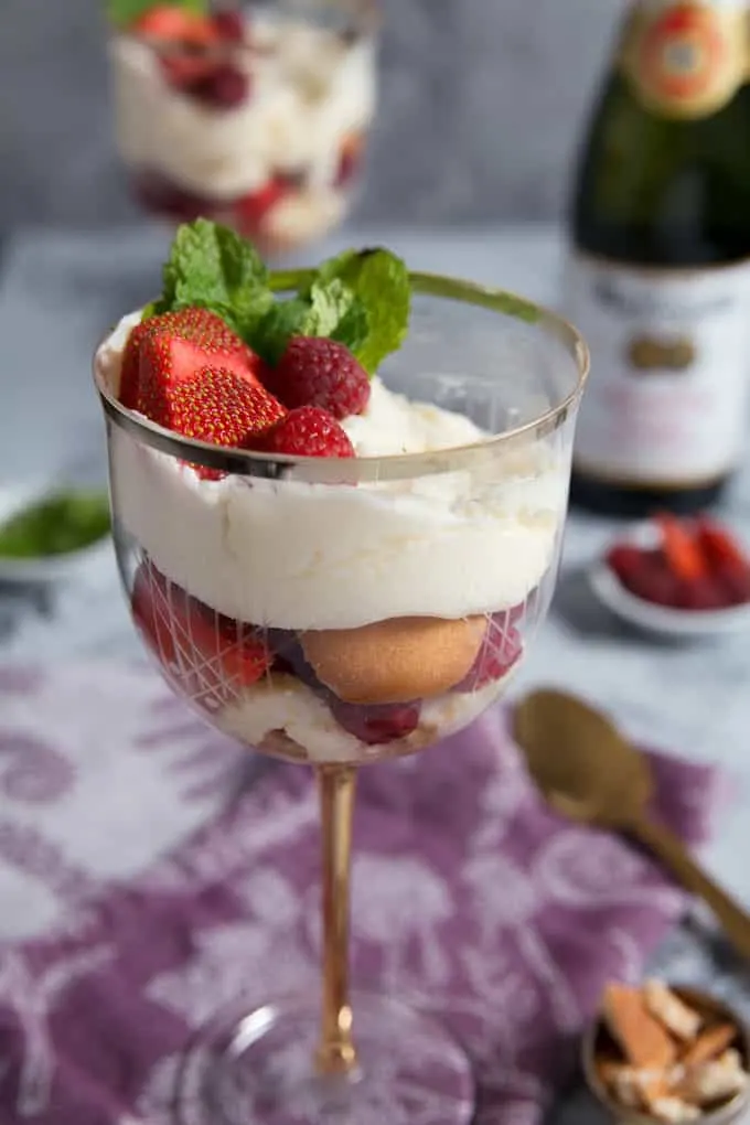 Raspberry Strawberry Parfaits with Sparkling Cider Frosting in a wine glass