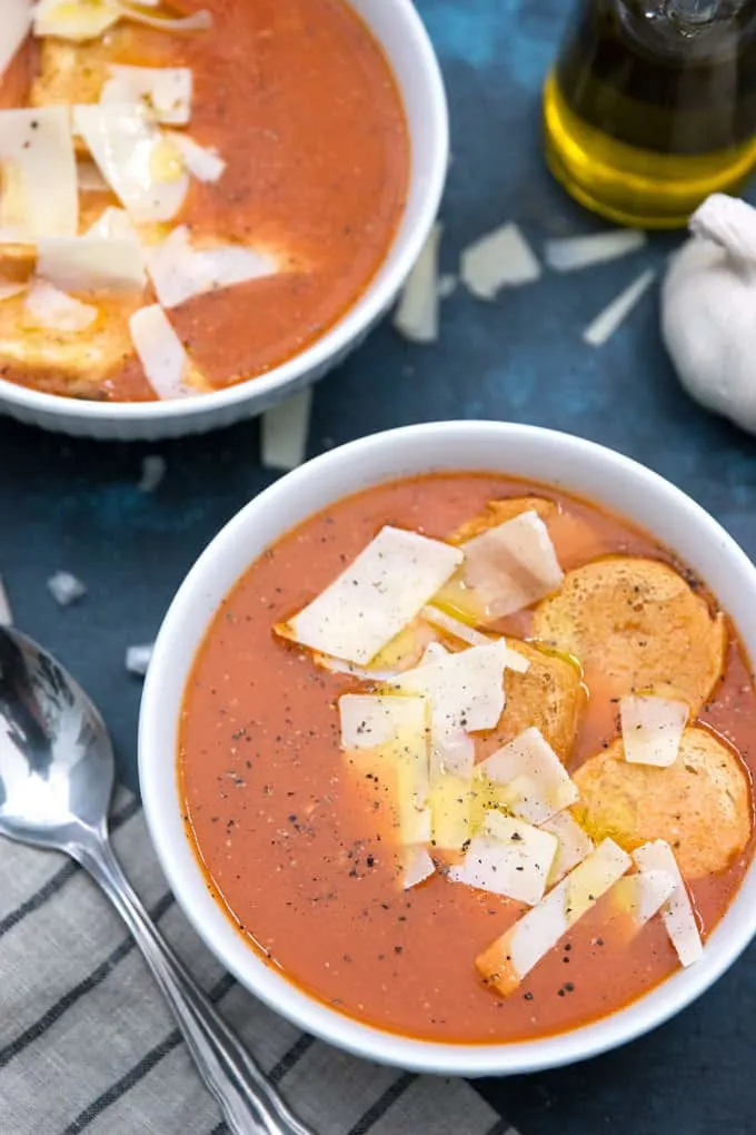 two bowls of roasted garlic tomato soup