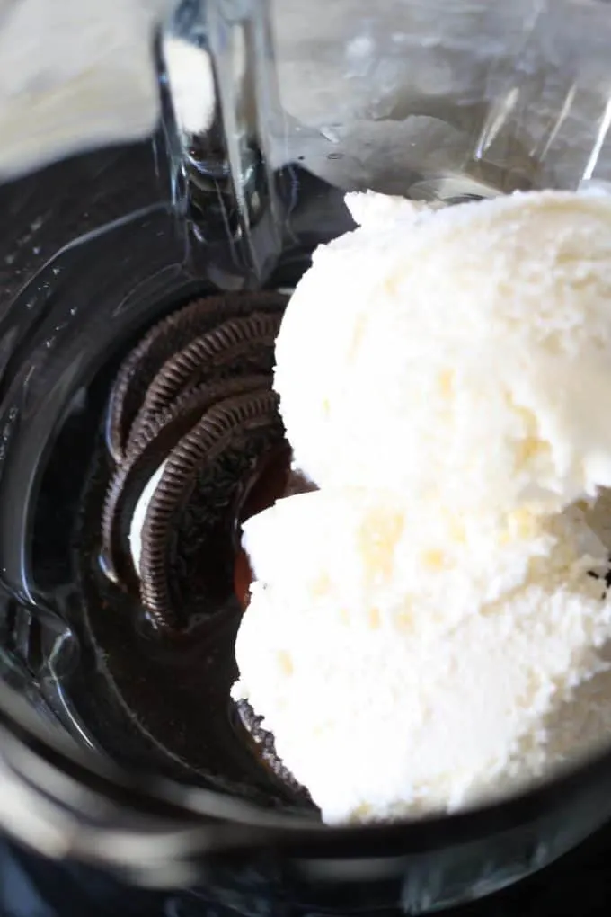 chocolate sandwich cookies and ice cream in a blender