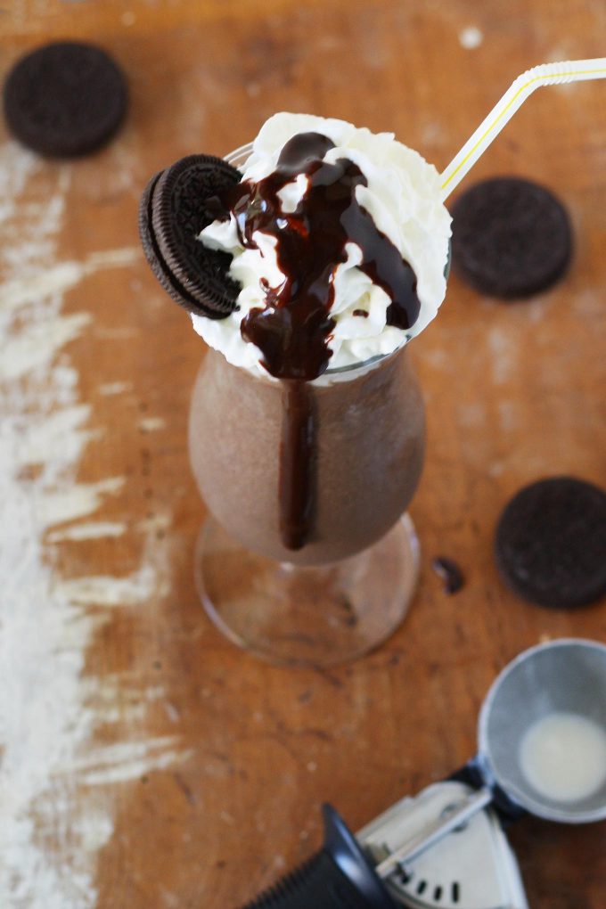 cookie and coffee milkshake on a wooden board