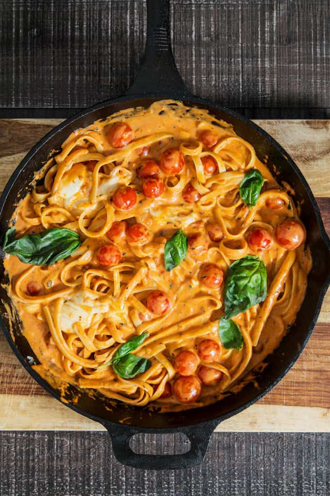 Rosa Chicken Caprese Pasta in a cast iron skillet