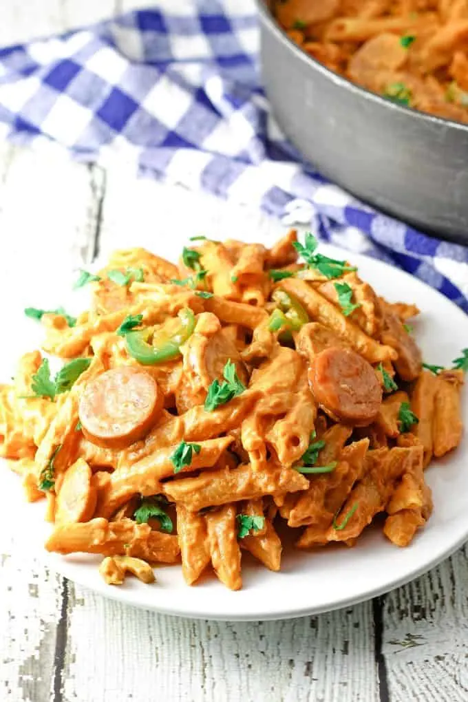 white plate of spicy sausage pasta