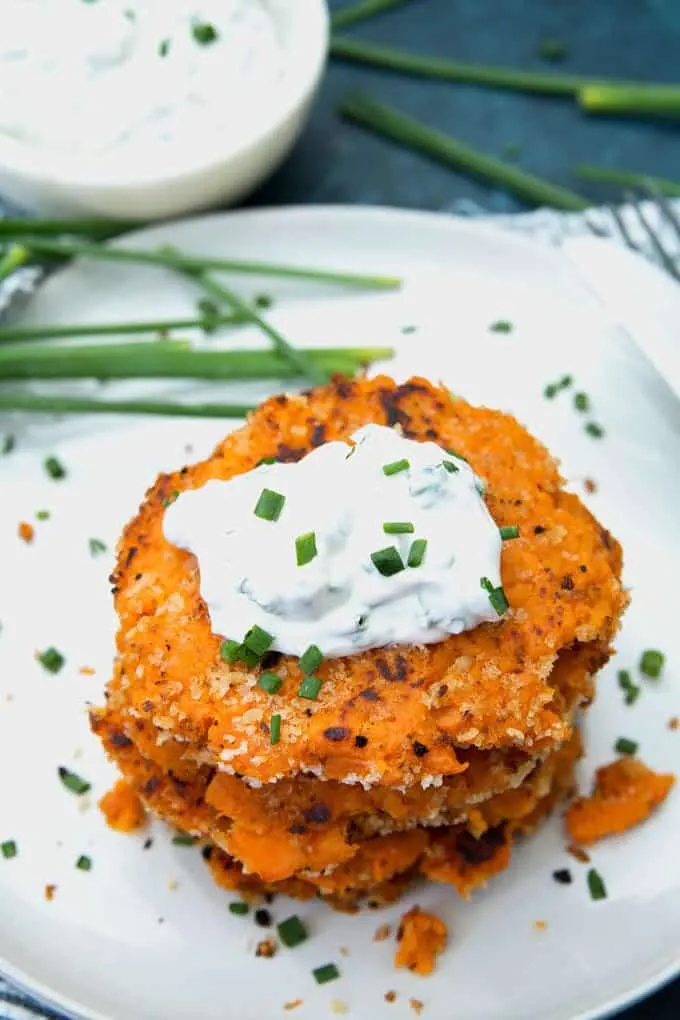 photo of sweet potato pancakes topped with chive sauce