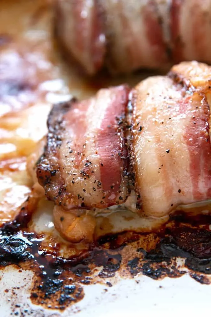 closeup photo of stuffed cilantro lime chicken wrapped in bacon