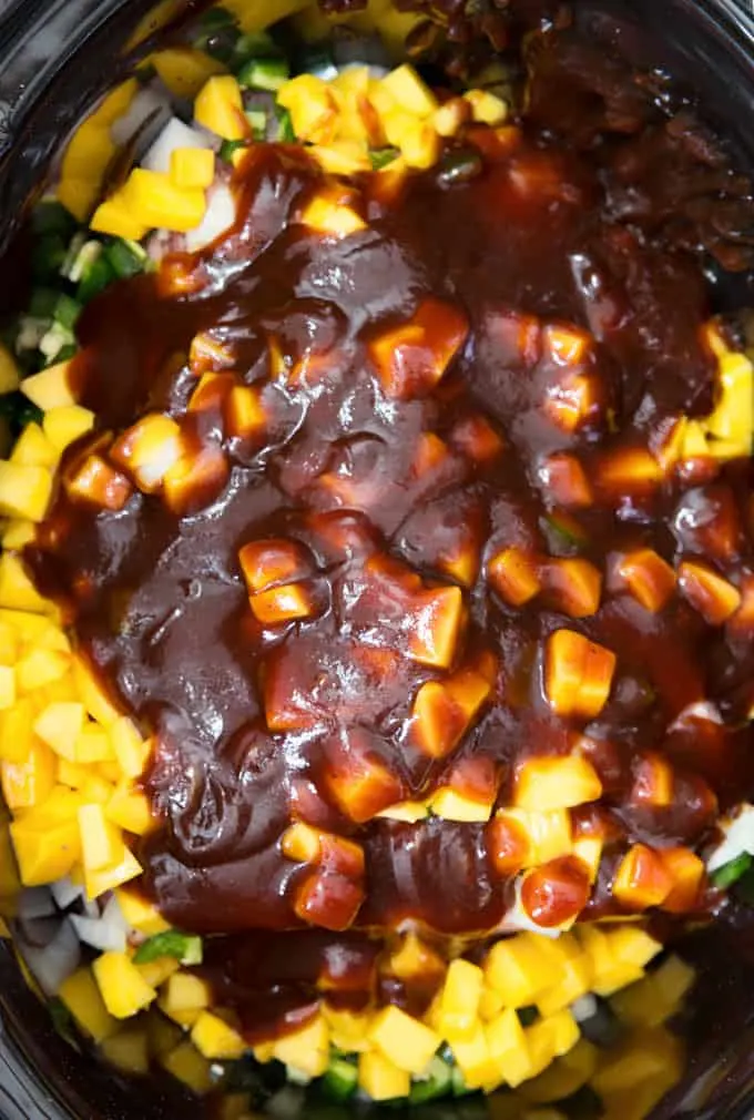 bbq sauce on top of mango chunks