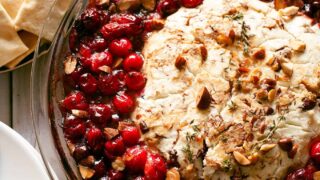 baked goat cheese and roasted cranberry appetizer overhead photo