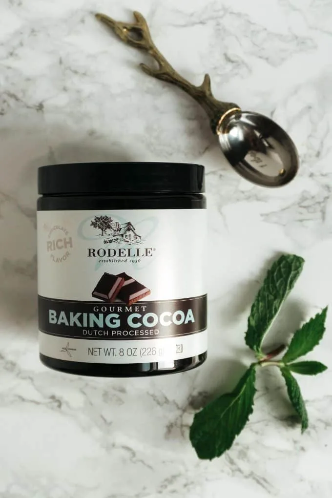 Rodelle gourmet baking cocoa and a mint sprig
