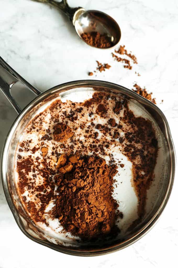 hot milk with gourmet baking cocoa in a small pot