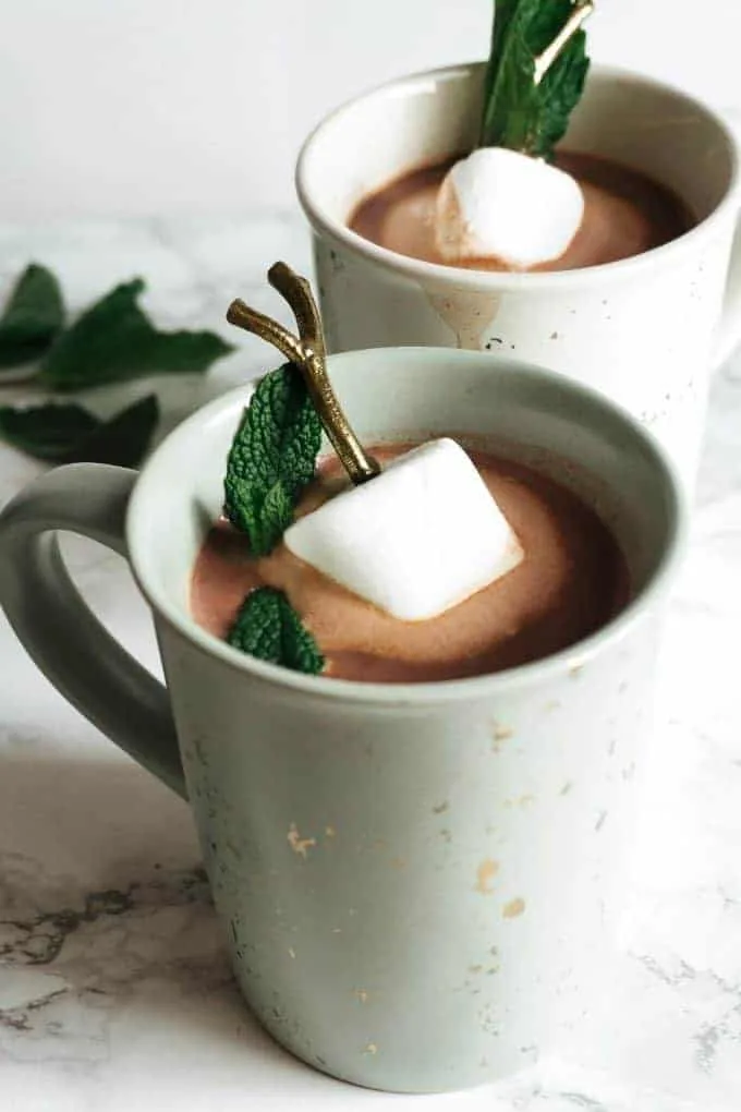 two mugs of boozy mint hot chocolate