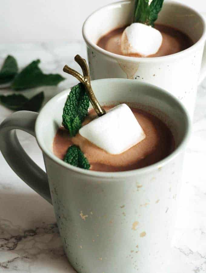 two mugs of boozy mint hot chocolate