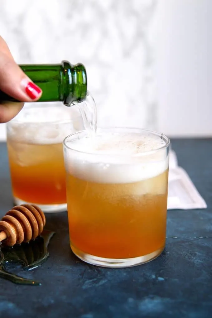 sparkling wine being poured into a glass