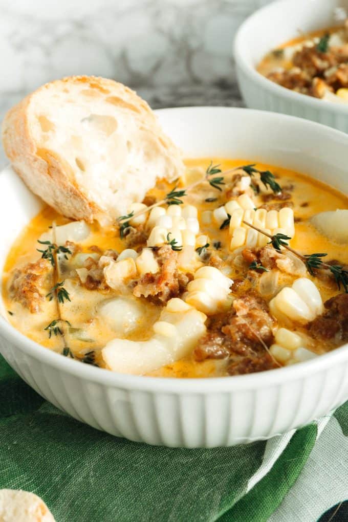 spicy sausage corn chowder in a white bowl