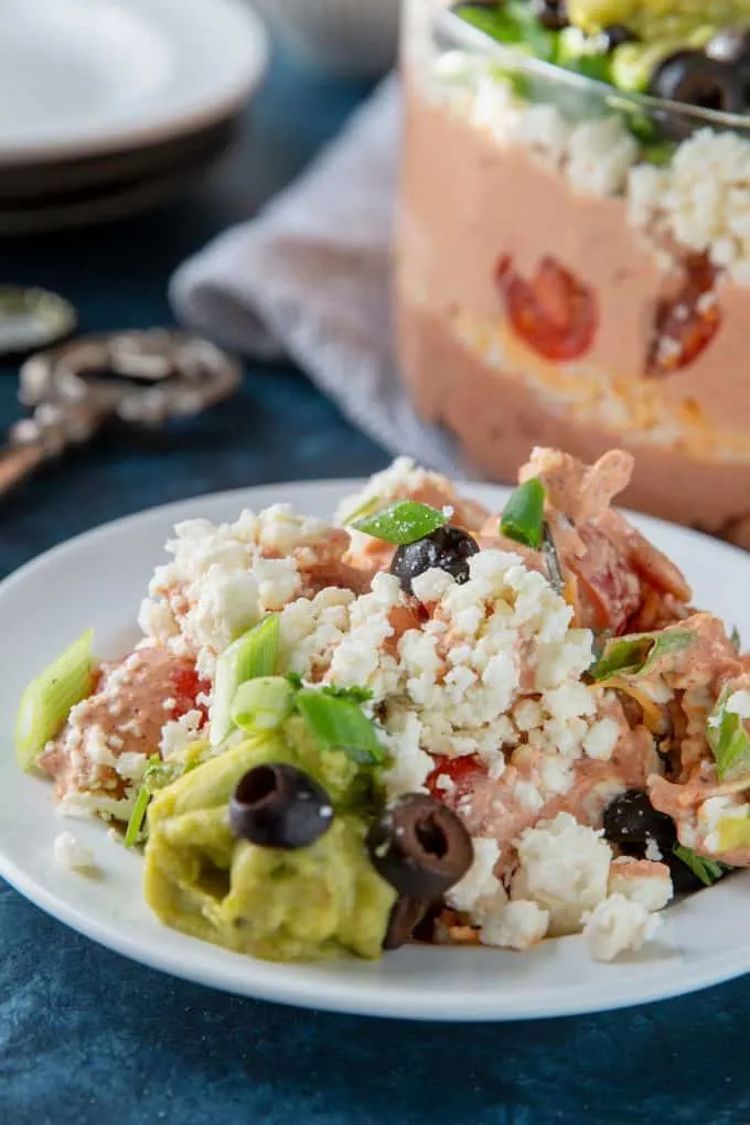 7 layer bean dip on a white plate