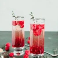 2 raspberry kir royale cocktails in tall glasses