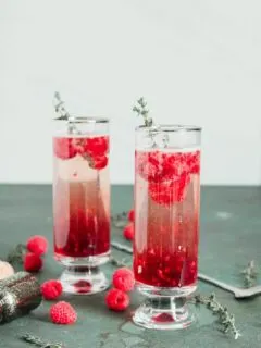 2 raspberry kir royale cocktails in tall glasses